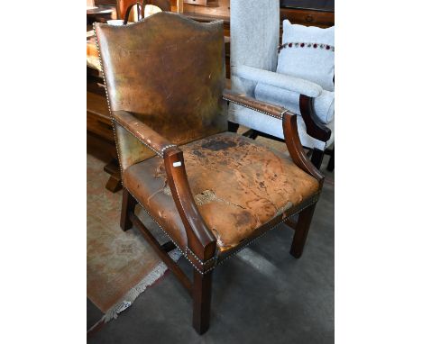 A mahogany framed Gainsborough style armchair with studded brown leather upholstery (F/R)&nbsp; 