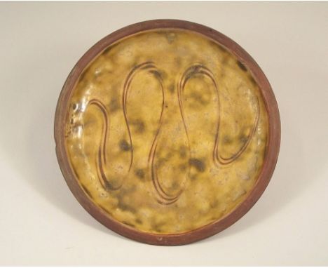MICHAEL CARDEW. An early Winchcombe Pottery slip ware plate by Michael Cardew. Personal & Pottery impressed marks. Diameter 2