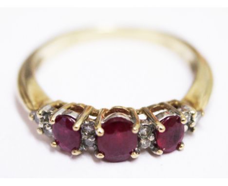 A 9ct gold diamond and ruby ring. Wt. 2.5g Size N
