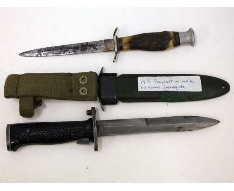 An M5 bayonet and scabbard and another knife. Condition - scabbard broken, general wear to include dings, scratches etc.