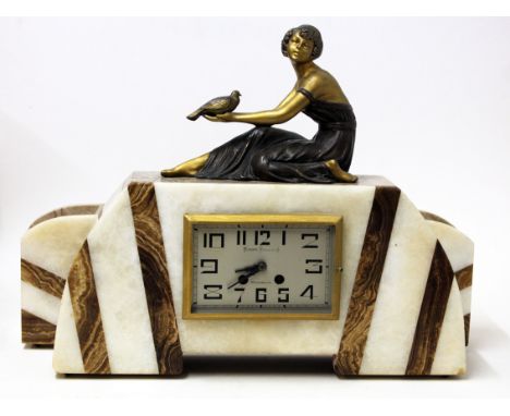 An Art Deco three piece clock garniture by Roger Konrad (Sourdeval). L43cm. Condition - minor chip to left corner, general we