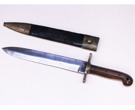 A reproduction US Navy knife and scabbard. Condition - blade good but blunted, wear to scabbard.