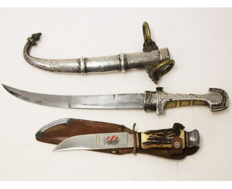 A Turkish dagger and scabbard together with a Reichsparteitag Nurnberg knife with leather sheath