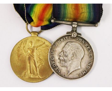 A WWI pair each inscribed 32129 P.T.E. A. ANDERSON. R. LANCS. R.