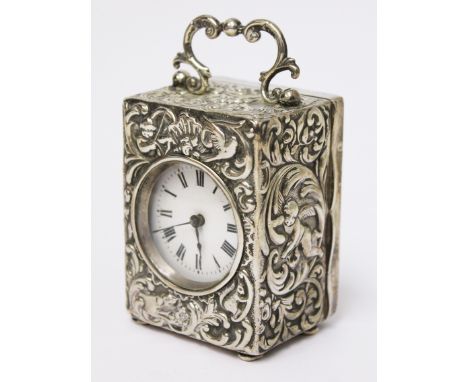 A Victorian embossed silver carriage clock. Dimier Brothers London 1898. H9.5cm. Condition - I can't see any holes, screw rep