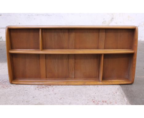 An Ercol elm shelf. L107cm