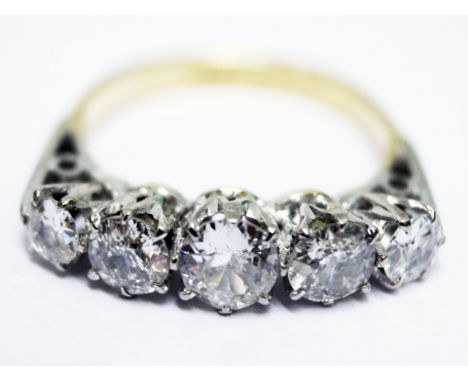 An 18ct gold and platinum five stone diamond ring, approx. total diamond wt. 1.40 carats, size M.