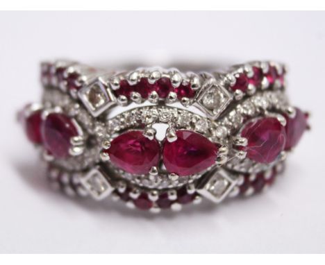 An 18ct white gold diamond ruby ring. Wt. 9.1g Size N