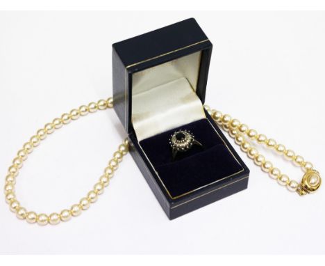 A 9ct gold ring together with simulated pearl necklace