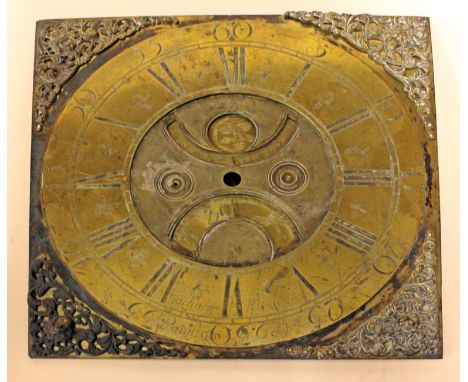 A brass clock dial inscribed 'Joshua Mosley Peniston Fecit'. 28.5cm x 28.5cm