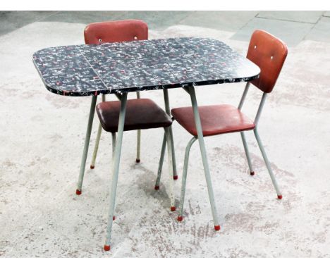 A retro vintage kitsch table and two chairs. H74.5cm