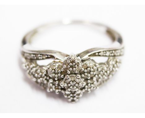 A 9ct white gold diamond ring. Wt. 3.4g Size N