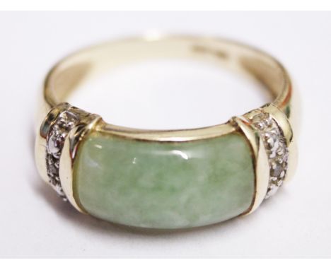 A 9ct gold jade and diamond ring. Wt. 3.5g Size M