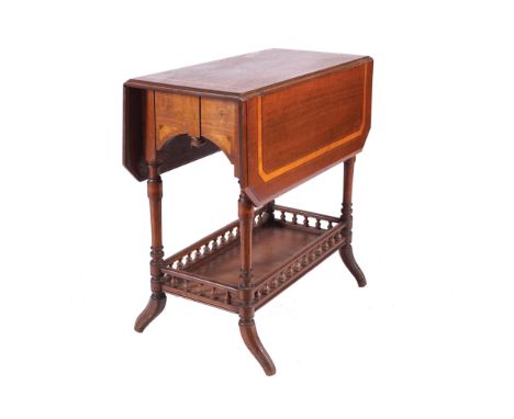 EDWARDIAN MAHOGANY AND SATINWOOD INLAID SUTHERLAND TABLEThe elongated rectangular top with chamfered drop leaves raised on tu