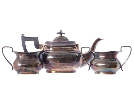 THREE PIECE SHEFFIELD SILVER PLATED TEA SERVICEComprising: teapot sugar bowl and cream jug16 cm. high; 29 cm. wide; 11 cm. de