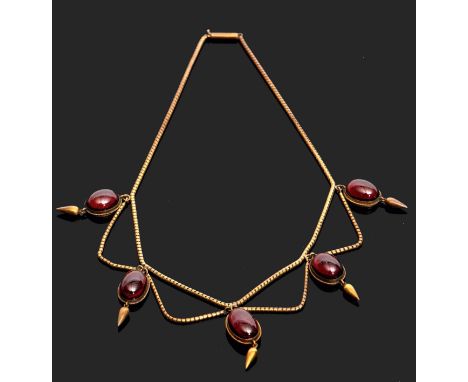 Victorian garnet necklace circa 1860, designed as a fringe of five cabochon garnets, each with pippin drops below, the bottom