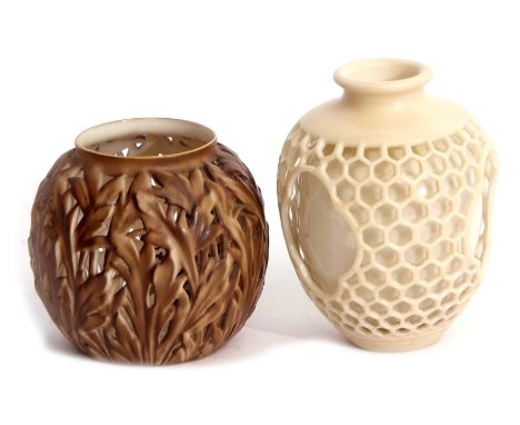 Pair of Royal Worcester early 20th century vases, the first double walled with an outer reticulated finish, the second with a