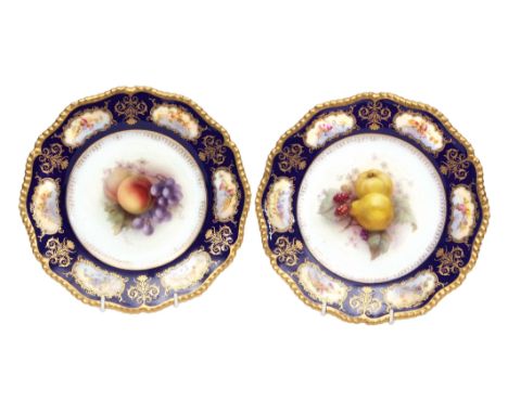 Pair of Royal Worcester plates, finely painted with fruit by Richard Seabright, the blue ground borders with gilt cartouche e