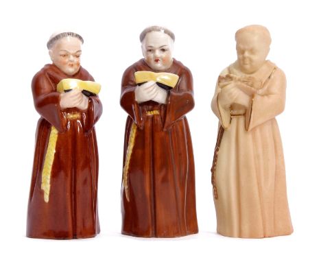 Group of three early 20th century Royal Worcester candle snuffers modelled as monks, one blush porcelain example, the tallest