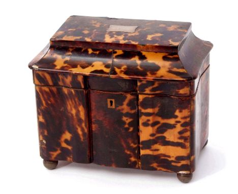 Tortoiseshell tea caddy of shaped rectangular form with sarcophagus top with central white metal vacant name plate enclosing 