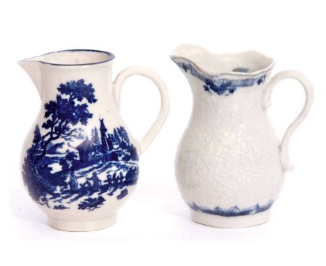 Two Worcester porcelain sparrowbeak jugs, one with a moulded design with chrysanthemum pattern, the other with a European lan