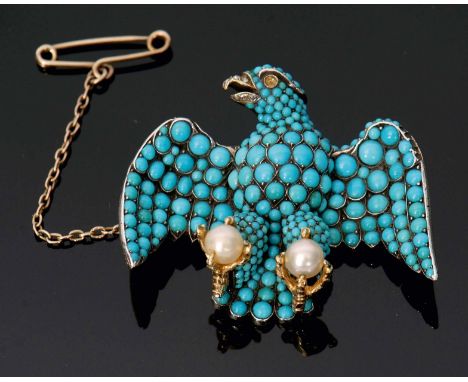 An interesting Victorian gold and silver brooch in the form of "The Coburg Eagle". The front with graduated turquoise stones 