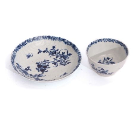 Worcester feather moulded tea bowl and saucer with a blue and white floral design with workman's mark to the base, the saucer