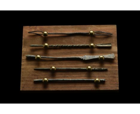 Ca. 100-300 AD. A rare set of five Roman surgical tools composed of a double-ended fork, spoon, spatula, and probes. Each too