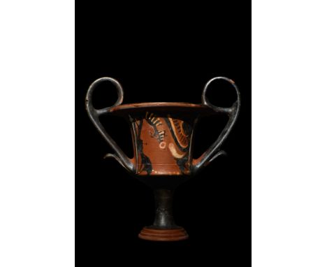 Apulian, Ca. 350-300 BC. A rare red-figure kantharos. This tall stemmed cup has two sweeping high handles and a gently flared