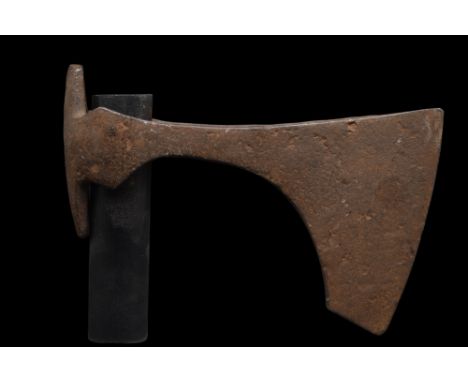 Ca. 900-1100 AD. An iron bearded axe head with an elongated, curved blade and tapering cheek. The bearded axe, or Skeggøx (fr
