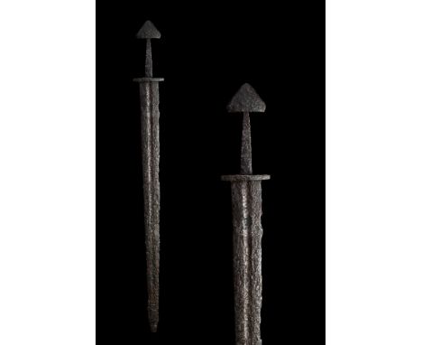 Ca. 10th Century AD. This sword of the Viking era is largely intact, with the pommel, lower cross guard, blade, and tang all 