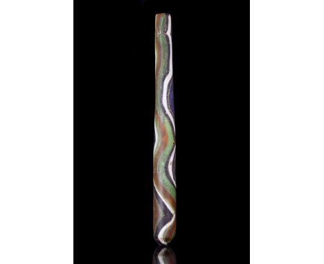 Ca. 300-400 AD. A beautiful cylindrical, multicolour (black, blue, white, green) alabastron tapering towards the mouth. Alaba