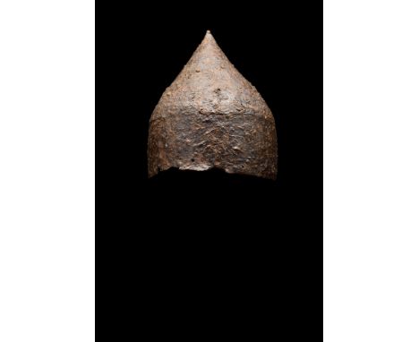 Ca. 900-1000 AD. A rare Viking period iron helmet; formed of triangular sections; attached with iron rivets passing through t