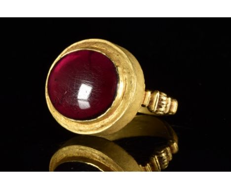 Ca. 200 BC. A stunning gold ring composed of a D-shaped hoop with its arms terminating in architectural form with a hinged me