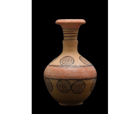 Cypro-Geometric Period, Ca. 1050-700 BC. A decorated pottery juglet with painted salmon color wide band and dark brown painte