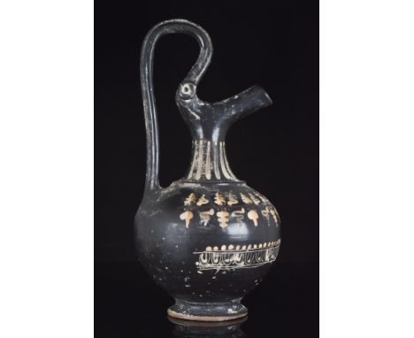Ca. 4th century BC. A pouring vessel known as a prochous, wheel-thrown and decorated with a lustrous black glaze. The vessel 
