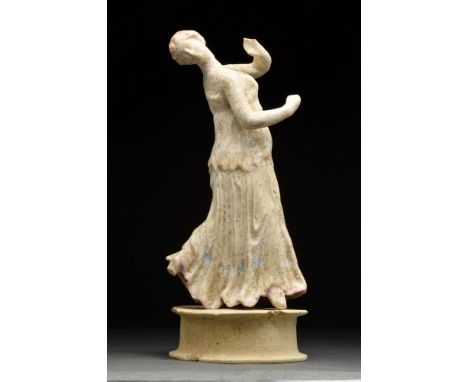 Ca. 200 BC.Perhaps from Centurpipe, Sicily, depicted wearing a chiton, her body twisting spirally to the right, head thrown b