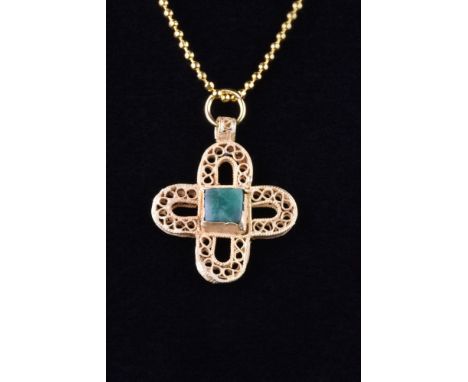 Ca. 800-1000 AD. A beautiful gold cross with intricate repeating curvilinear scrollwork decoration and a suspension loop. The