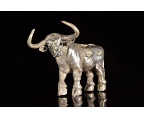 Ca. 1000 BC. A votive figure of a bull in a layer of sheet silver. The animal is standing in a naturalistic position, the thi