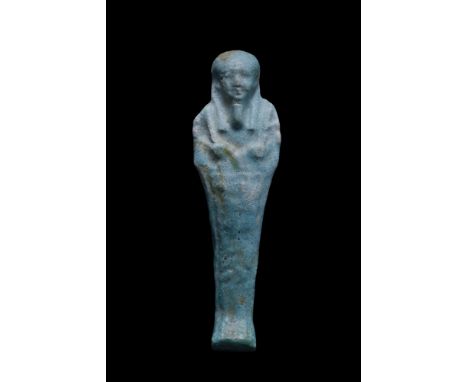 Late Dynastic Period, Ca. 664-332 BC. A mummiform figure in the form of an ushabti, moulded in a light-blue, glazed faience, 