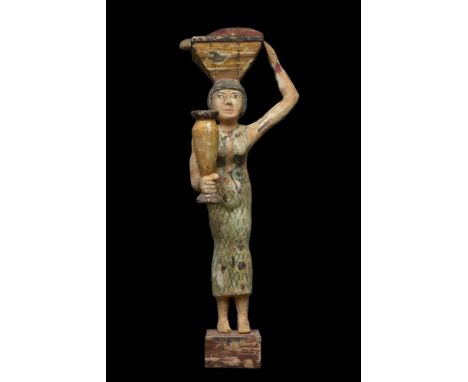 Late Period - Ptolemaic Dynasty, c. 663-30 BC. A polychromy wooden female figure with a basket on her head and a water vessel