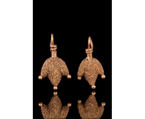 Ca. 100 AD. A matched pair of rare gold pendants shaped as a bird’s claw. The surface of each gold pendant is decorated with 