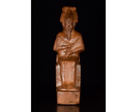 Ca. 664-332 BC, Late Dynastic Period.An Ancient Egyptian stone statuette depicting the god Osiris. He is shown seated in mumm