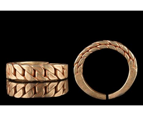Ca. 900-1100 AD. A rare type of hack-gold ring formed of a circular hoop with a braided median section and tapering arms. Thi