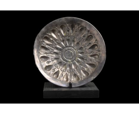 Ca. 400-300 BC. A museum-quality bowl hammered from a single sheet of silver with underside low-relief decorated with numerou