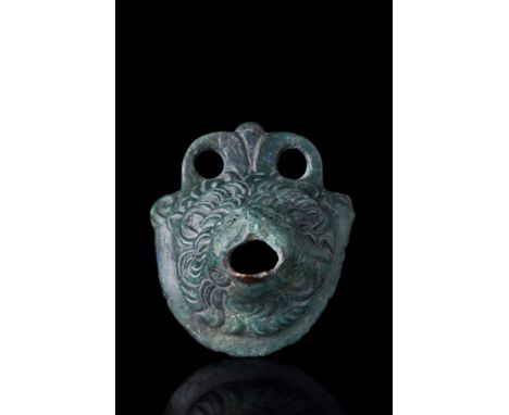 Ca. 1st–2nd century AD. A superbly cast lion protome with the rich full mane of overlapping wavy locks, the lion's mouth open