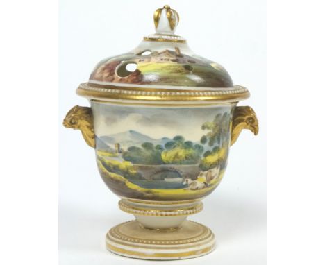 A late Regency pottery pot pourri vase, of urn form, polychrome decorated with Bucolic scenes with a farmhouse with a bridge 