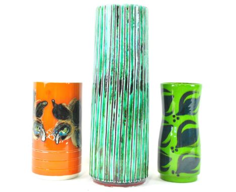 A Poole pottery green glazed ribbed form stick stand, 40cm high, together with two other Poole vases