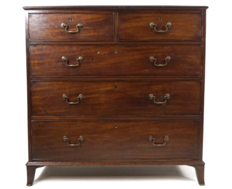 A George III mahogany chest of two short and three long drawers with brass swan neck handles on splayed bracket feet, 106cm h