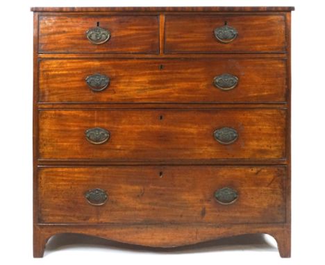 A George IV mahogany chest of two short and three long drawers, the brass handles with embossed back plates on bracket feet w